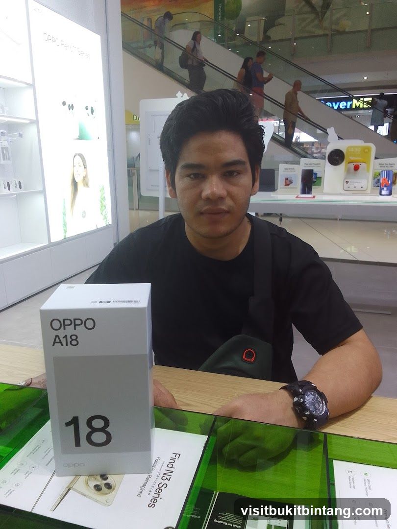 Man with OPPO A18 box