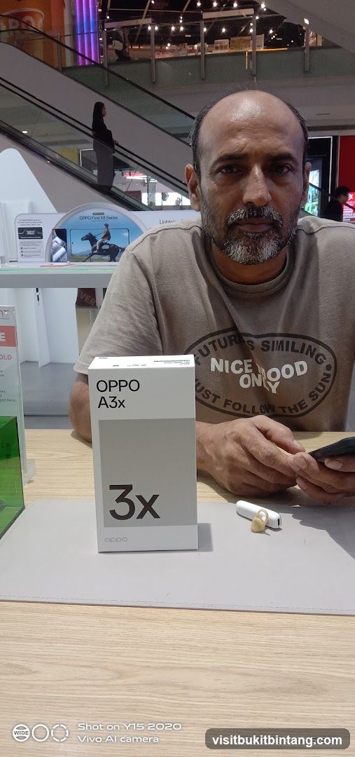 Man with OPPO A3x box