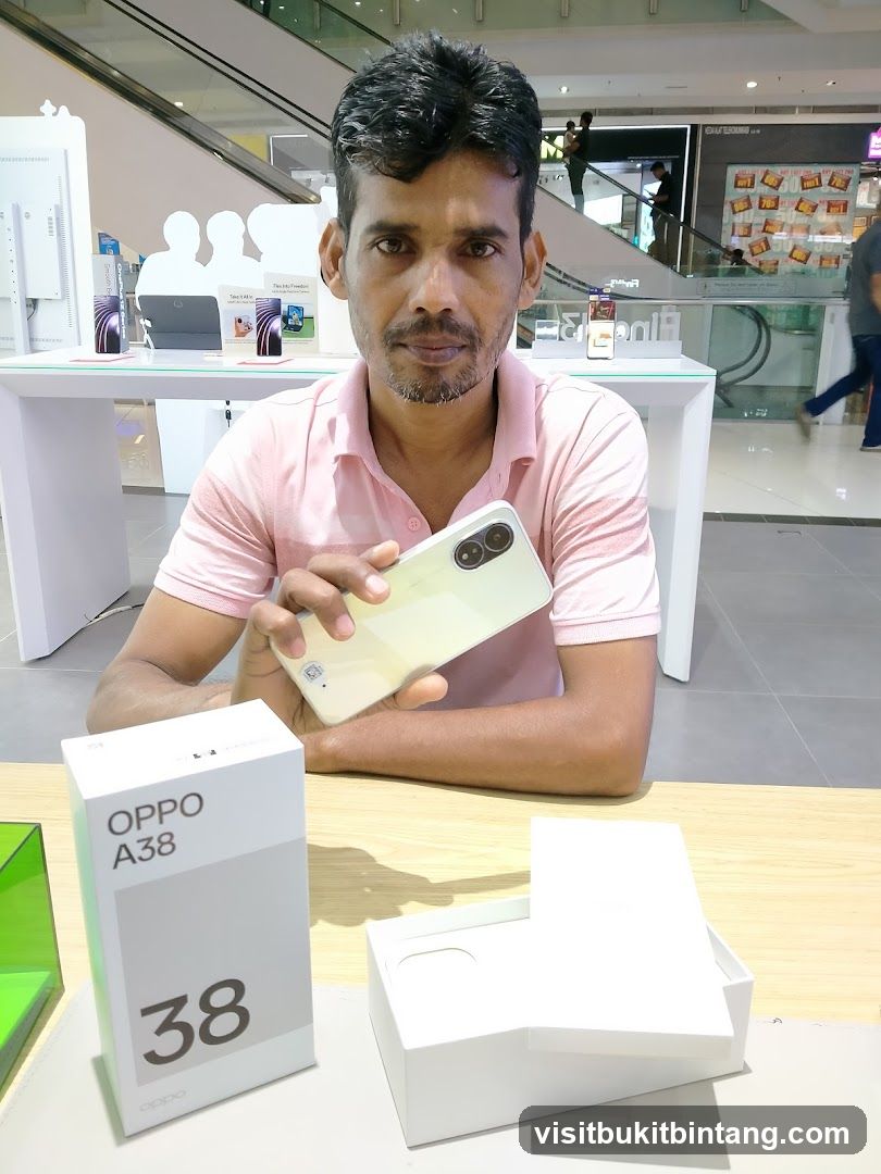 Man holding a smartphone with its box