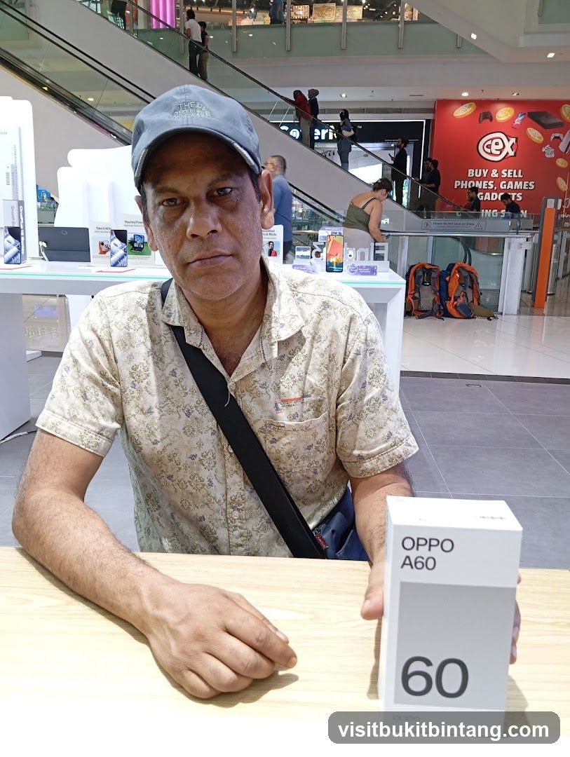 Man holding an Oppo A60 box