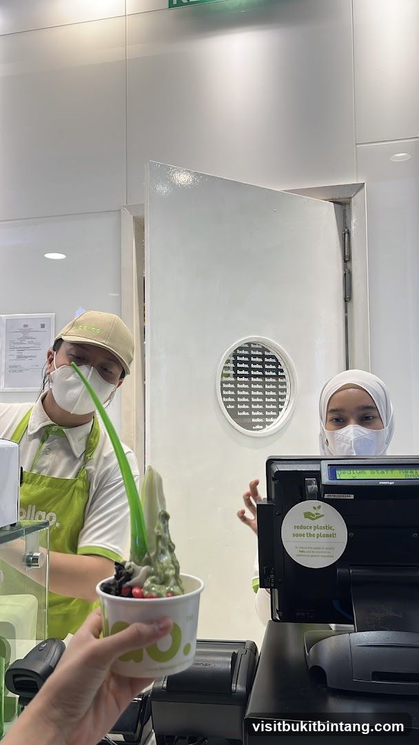 Staff serving frozen yogurt