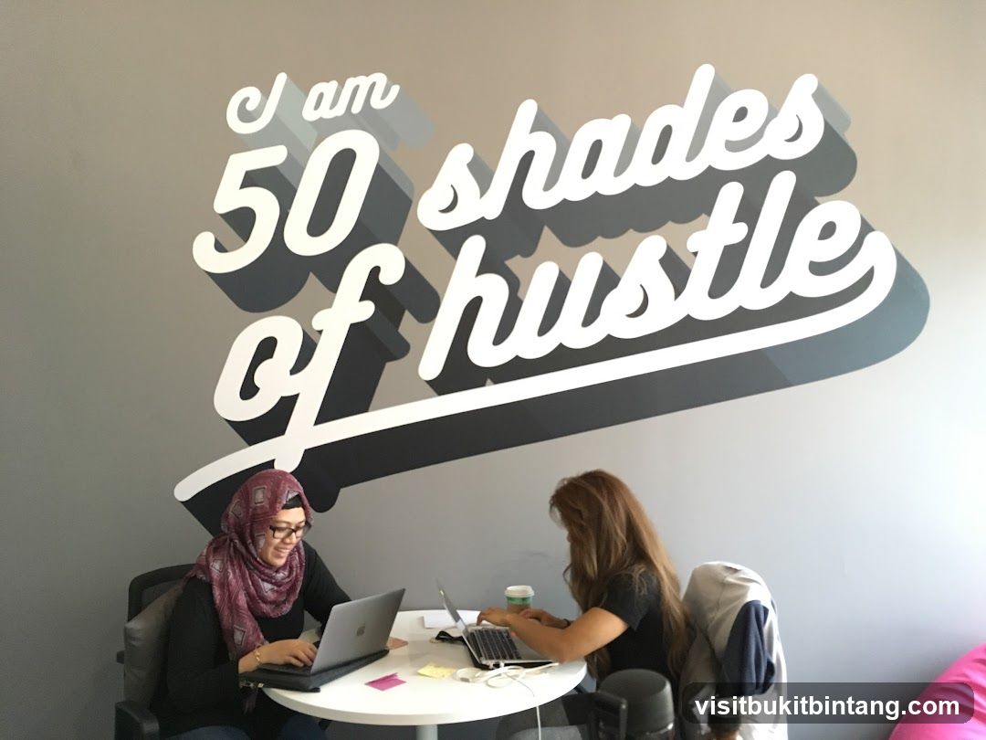 Two women working on laptops