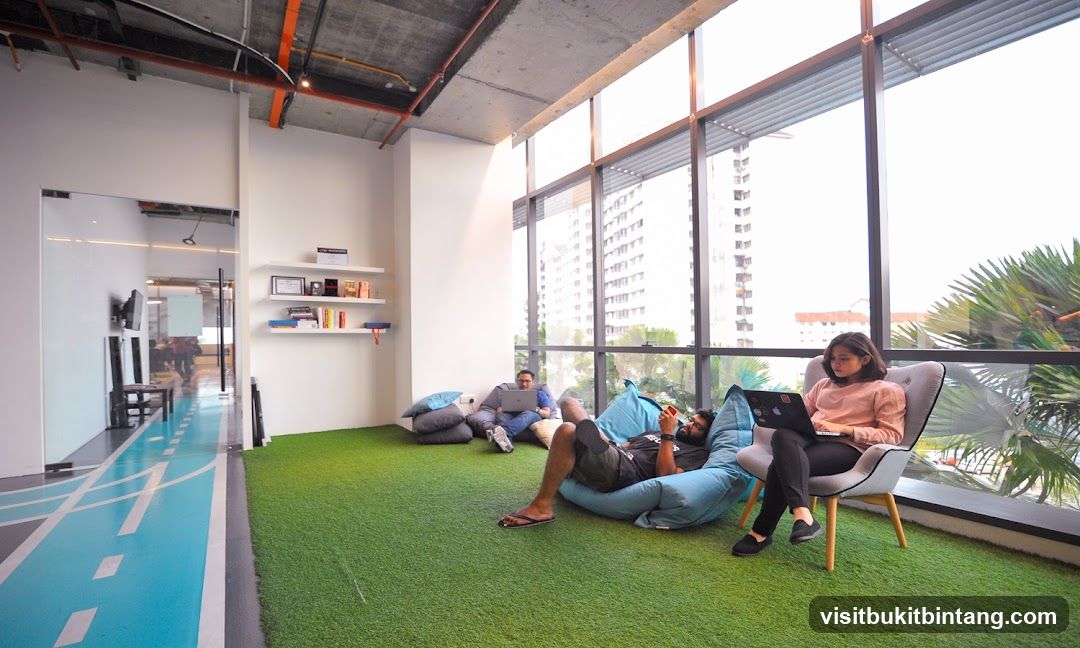 Modern Co-working Space with Green Carpet and Beanbags