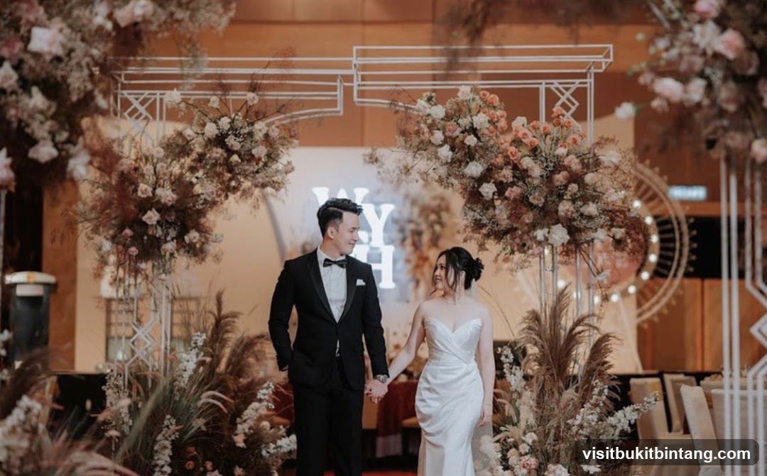 Wedding Couple Posing Under Floral Arch