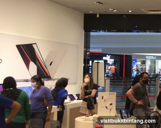 People browsing electronics store