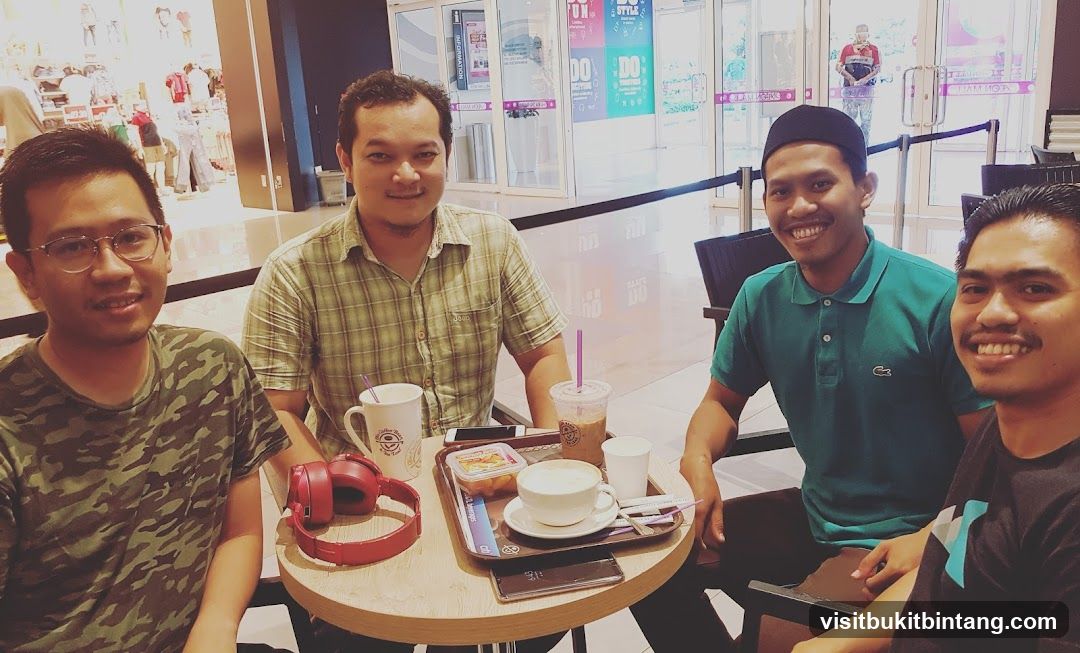 Four men at a coffee shop