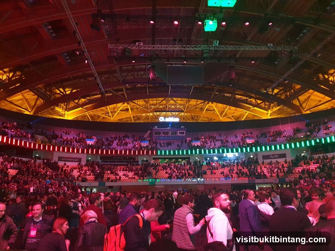 Crowded Arena with Colorful Lighting