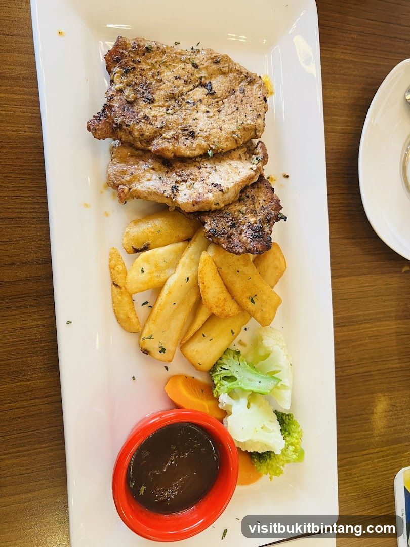 Pork Chops with Fries and Vegetables