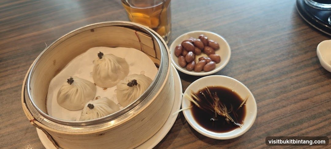 Soup Dumplings with Dipping Sauce and Peanuts