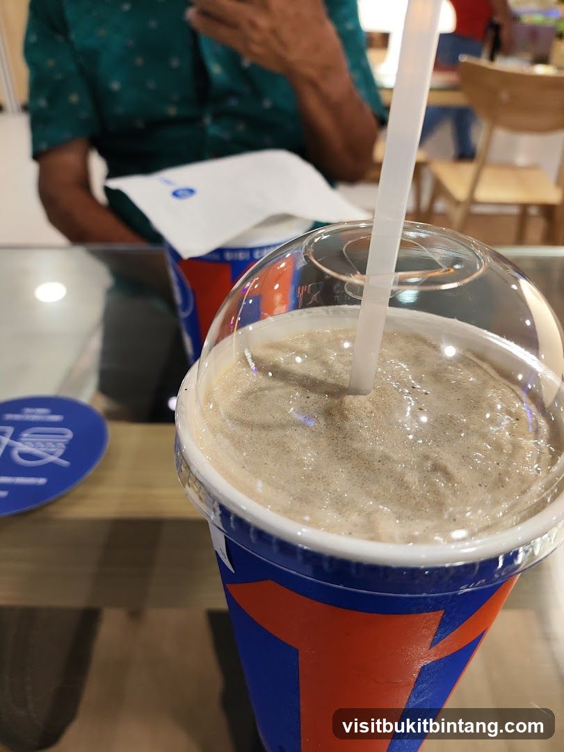 Beverage in a branded cup