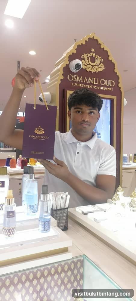 Man holding a shopping bag in a perfume store