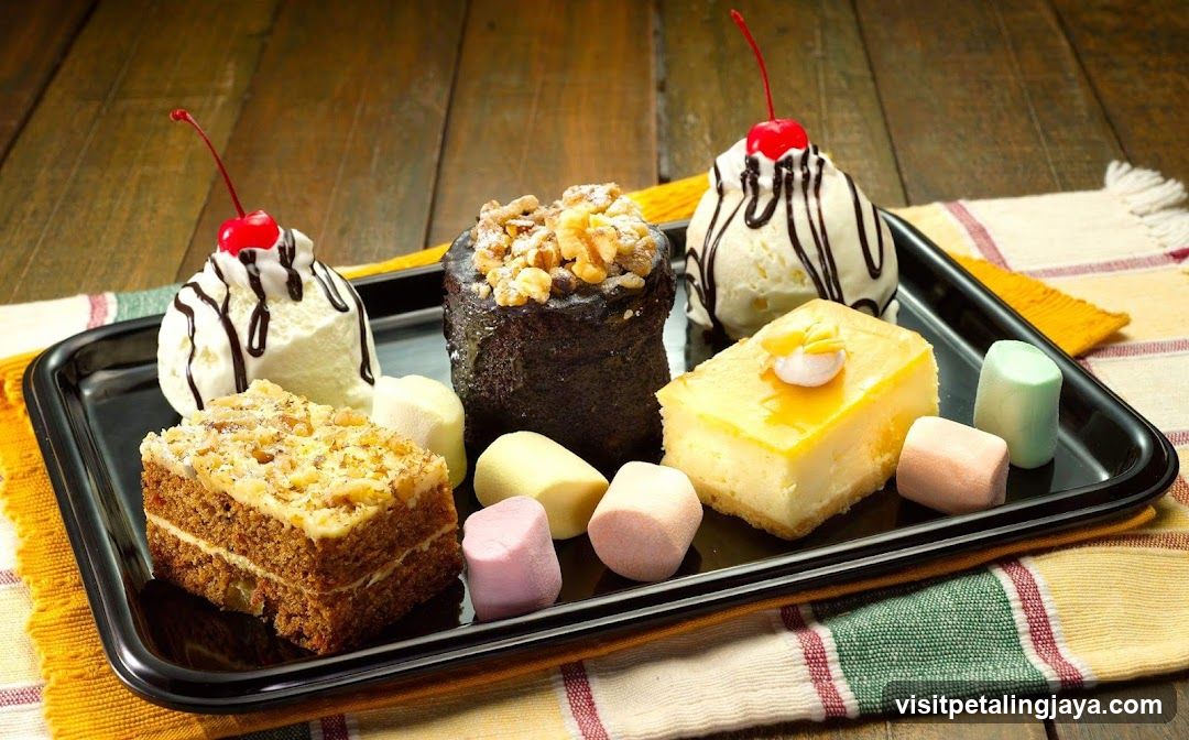 Assorted Desserts on a Black Tray