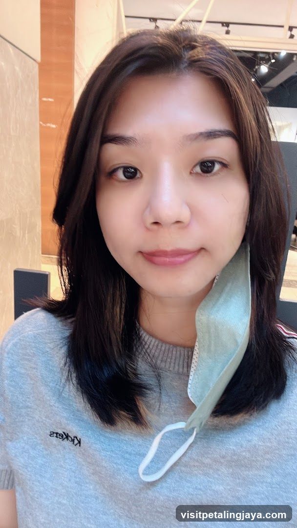 Selfie with mask hanging on ear