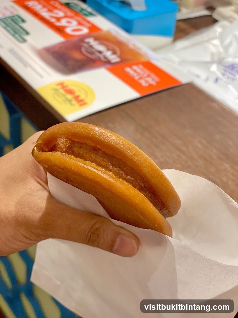 Hand holding a pastry