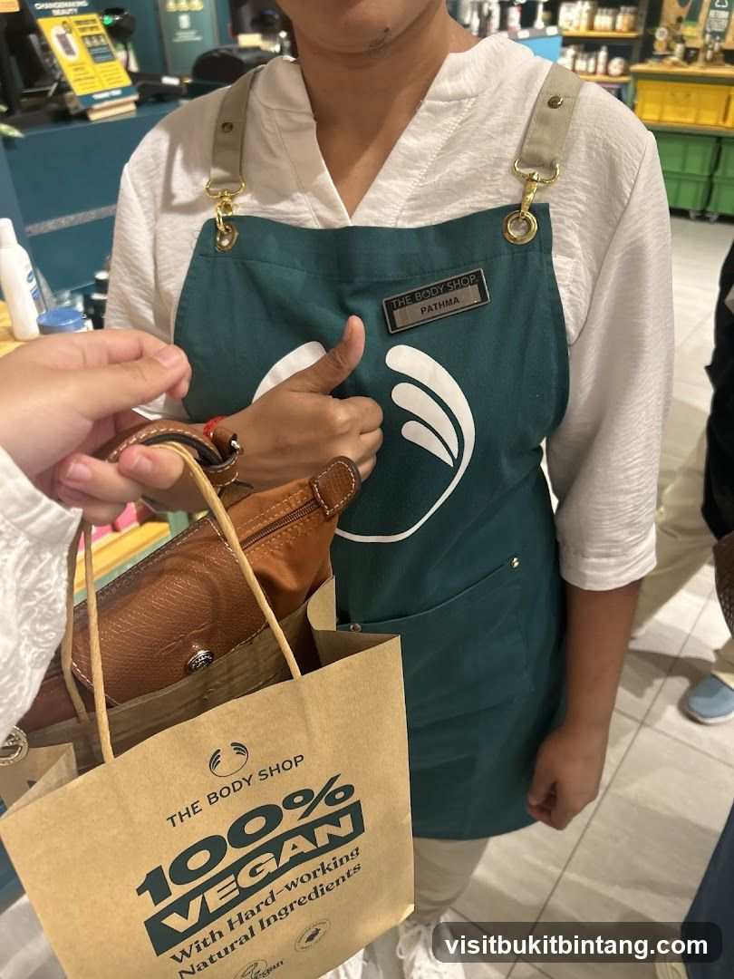 The Body Shop employee with shopping bag