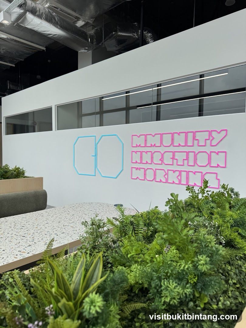 Office Interior with Neon Signage and Greenery