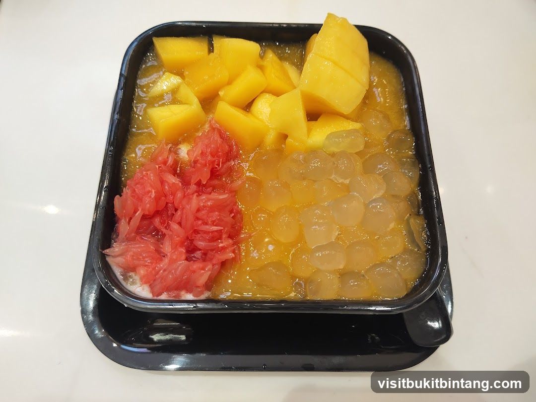 Mango dessert with grapefruit and boba