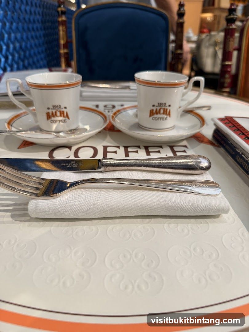 Coffee cups and cutlery on a table