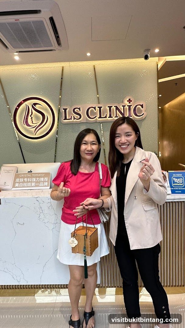 Two women posing in front of LS CLINIC