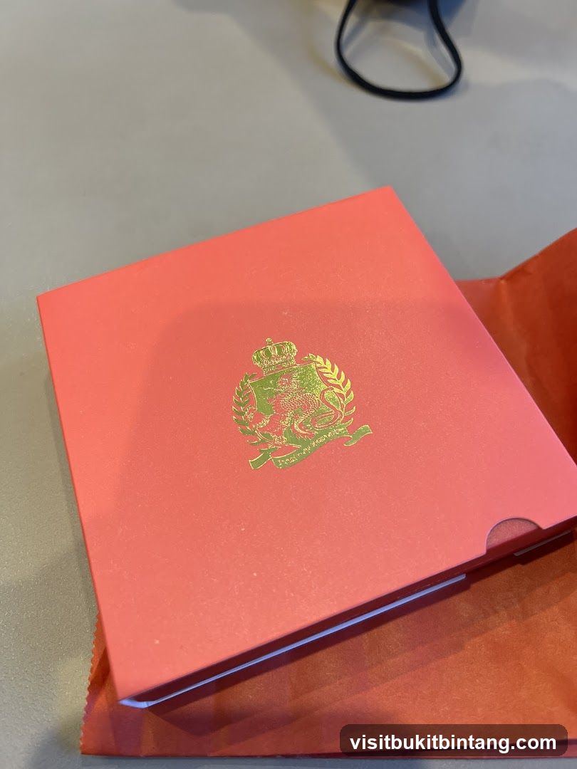 Coral box with gold crest