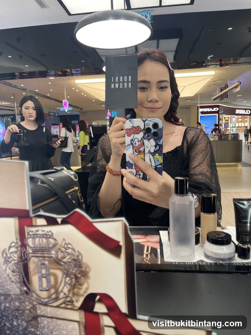 Woman holding a Bobbi Brown mirror