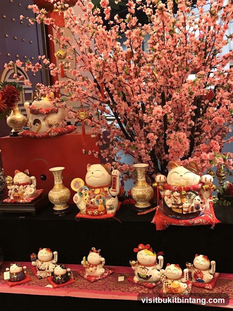Maneki-neko Figurines and Cherry Blossoms