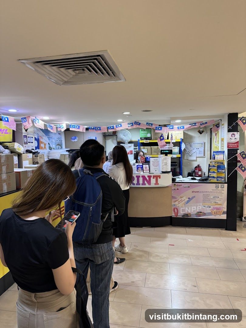 People queuing at a print and courier service counter