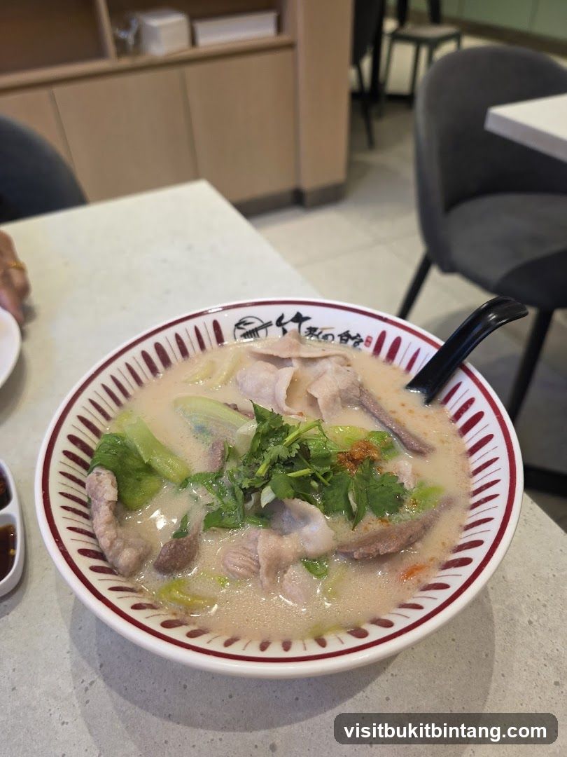 Bowl of Soup with Sliced Pork and Vegetables