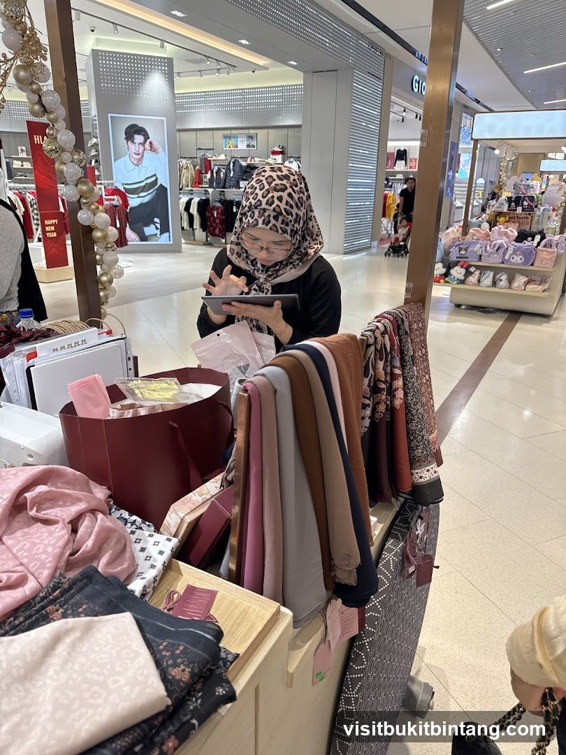 Woman using a tablet at a retail stall