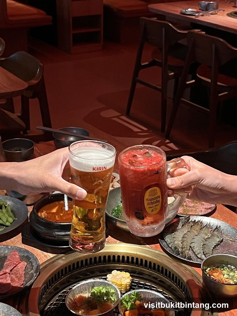 Friends toasting with drinks at a barbecue restaurant