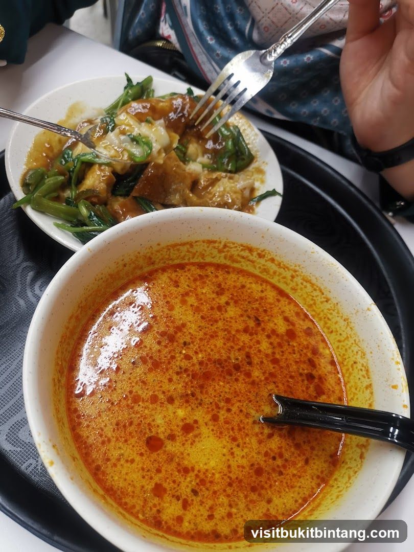 Two bowls of food on a tray