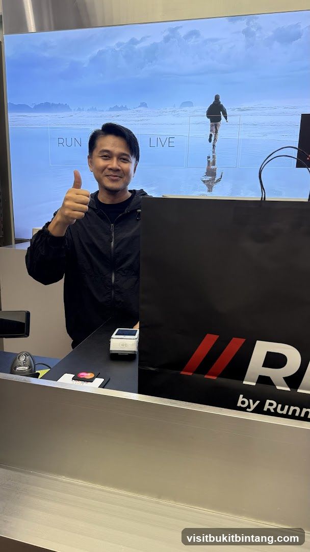 Man giving a thumbs up at a counter