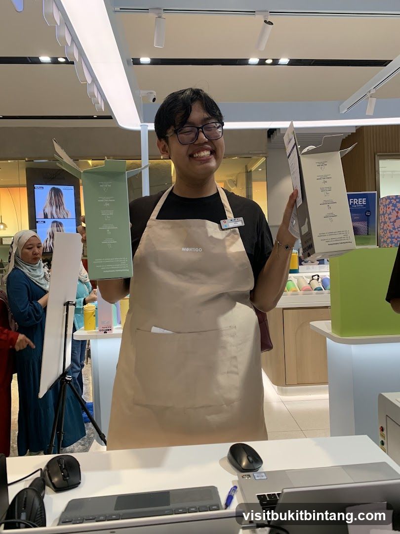 Smiling employee holding product boxes