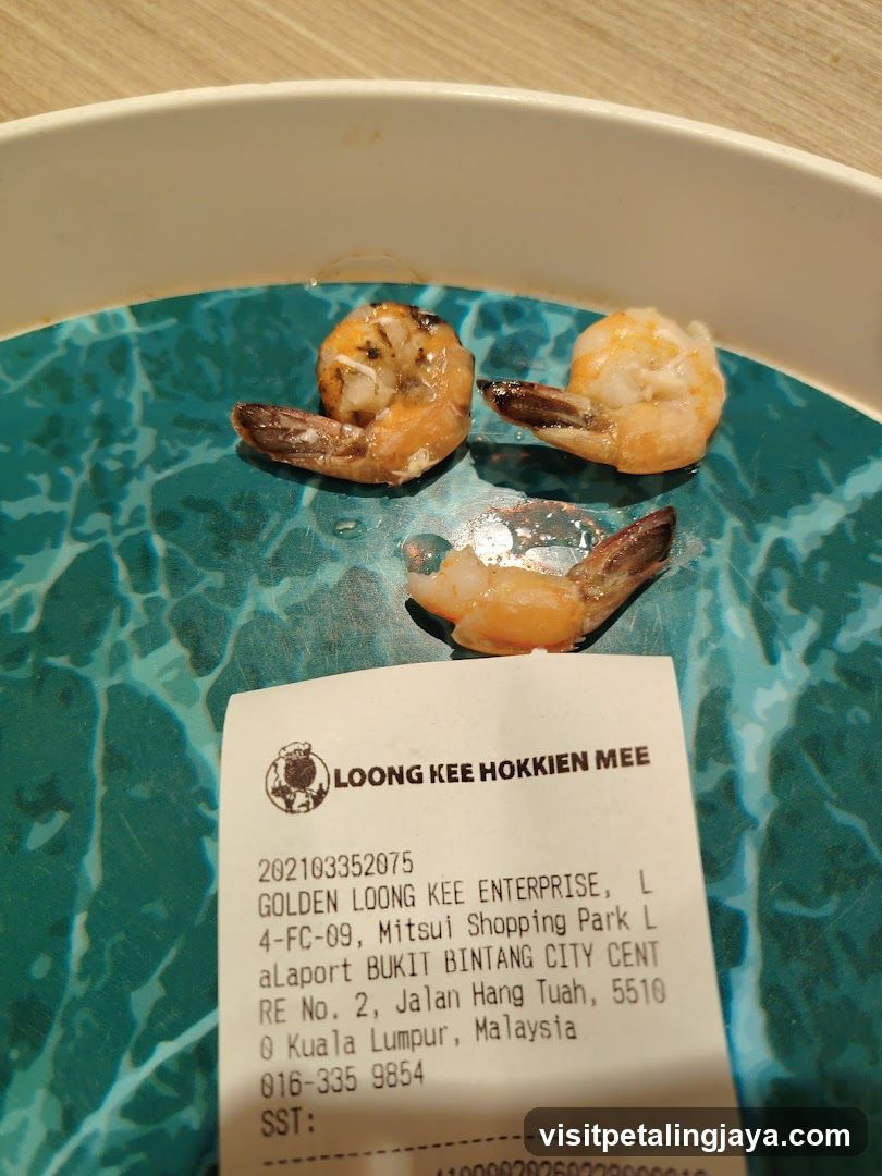 Shrimp on a plate with receipt