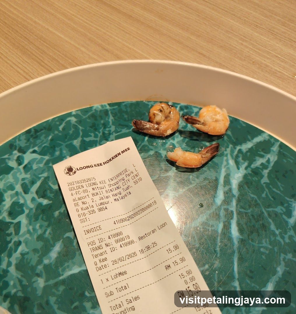 Receipt and Shrimp on Plate