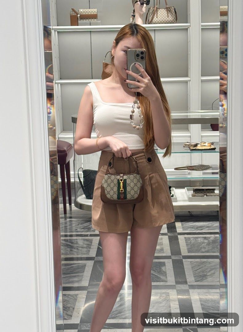 Woman holding a Gucci bag