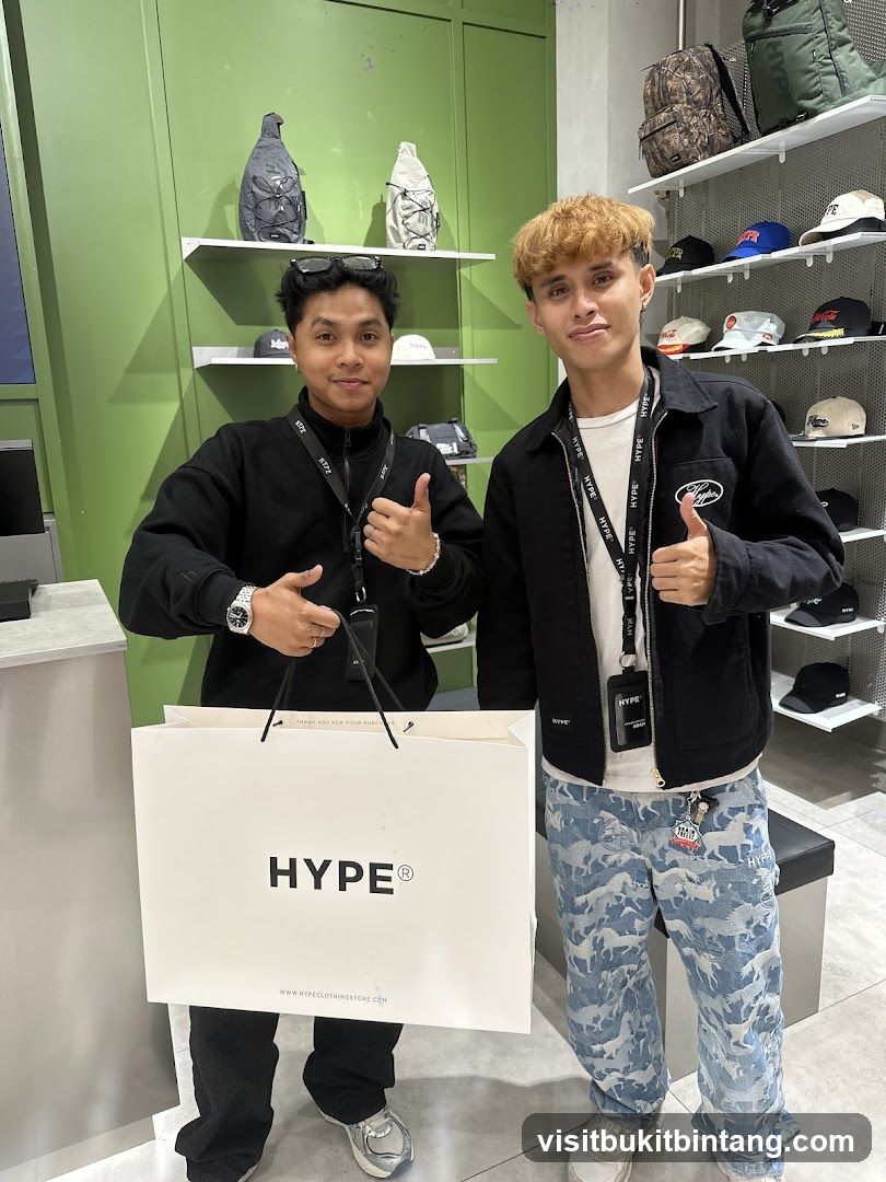 Two men holding a shopping bag