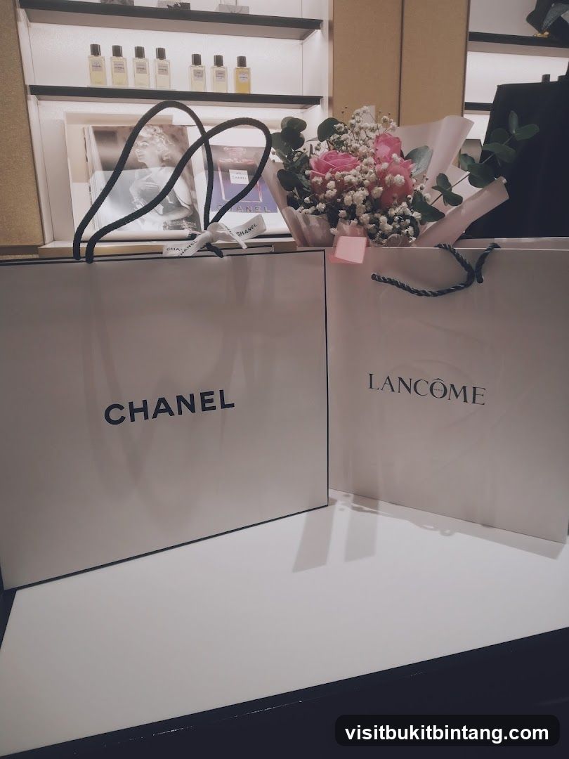 Chanel and Lancôme Shopping Bags with Flowers