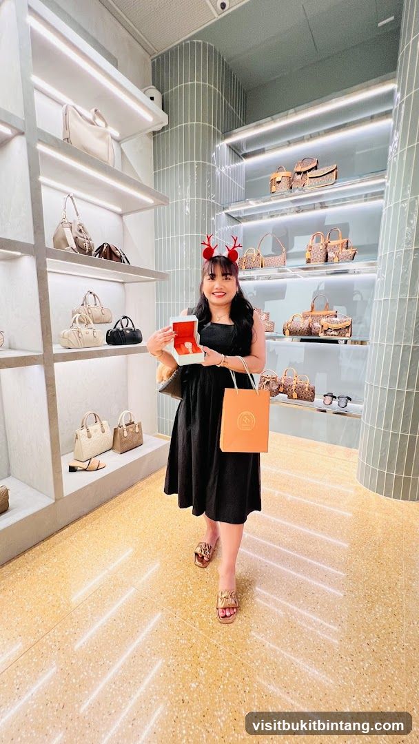 Woman holding a watch box in a handbag store