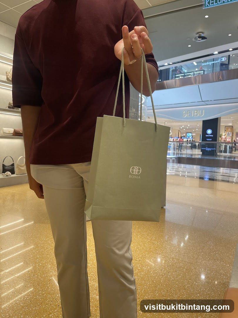 Person holding a shopping bag