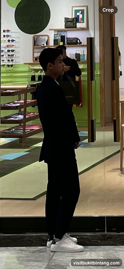 Man in a Suit Standing in a Store