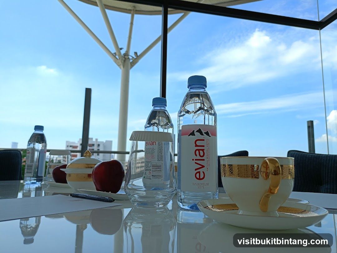 Table Setting with Evian Water and Coffee Cup