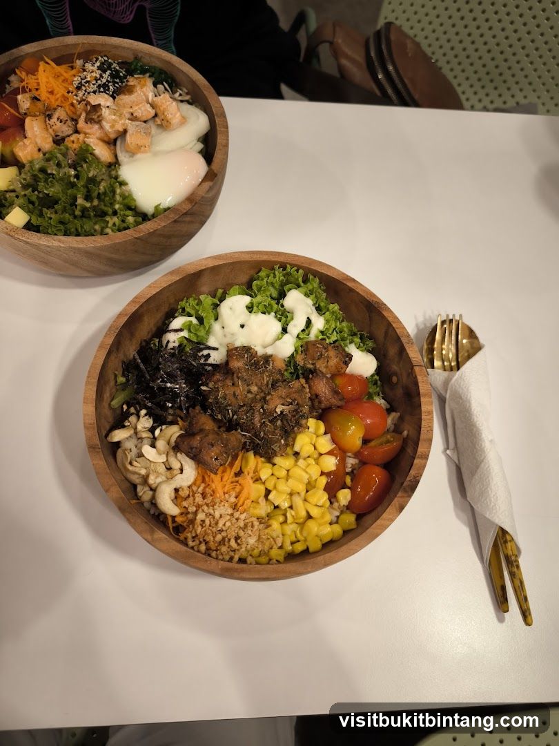 Two poke bowls on a white table