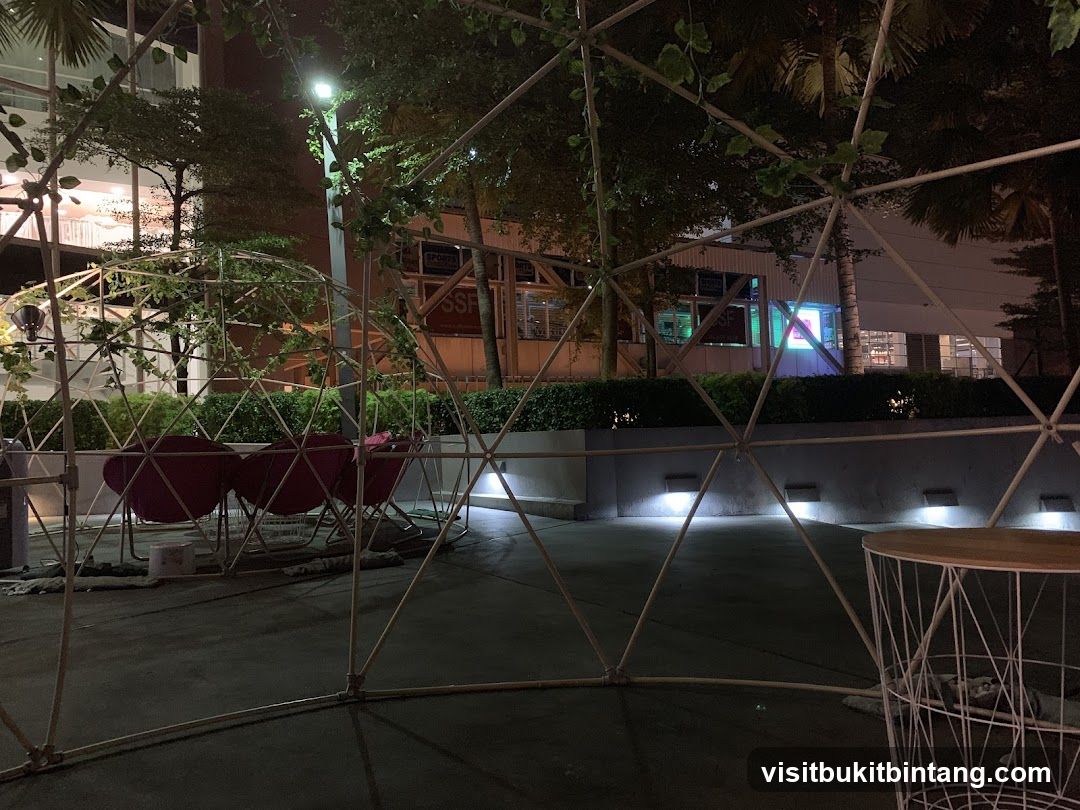 Outdoor seating area with geodesic dome structure