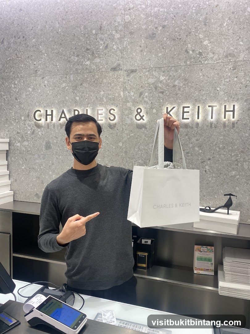 Man holding a shopping bag in a store