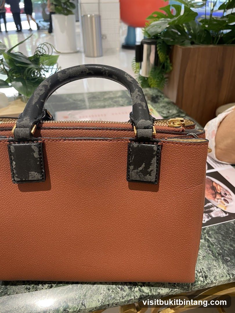Brown Handbag on Marble Table
