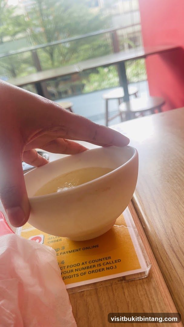 Bowl of liquid on a table