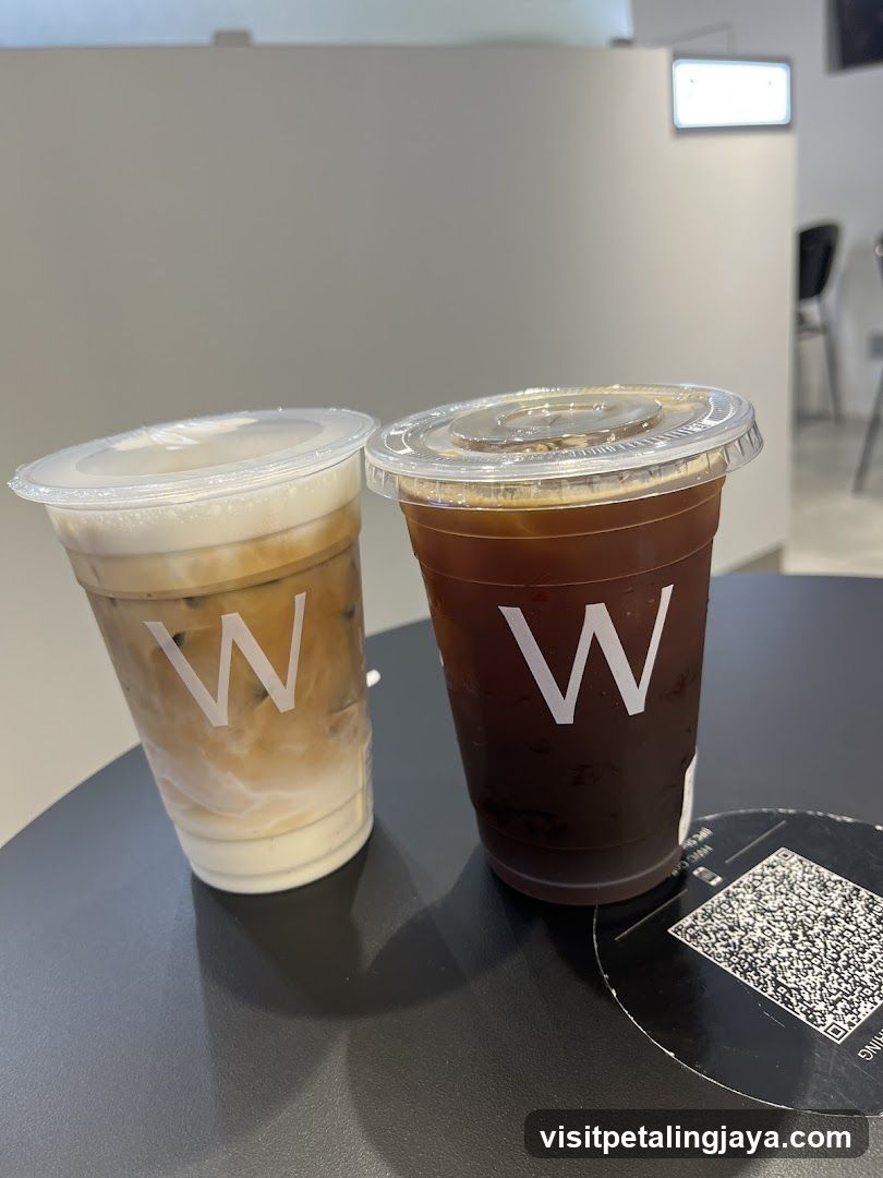 Two iced coffee drinks on a table