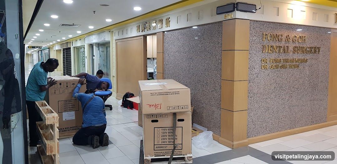 Dental Surgery Storefront with Staff Unpacking Boxes