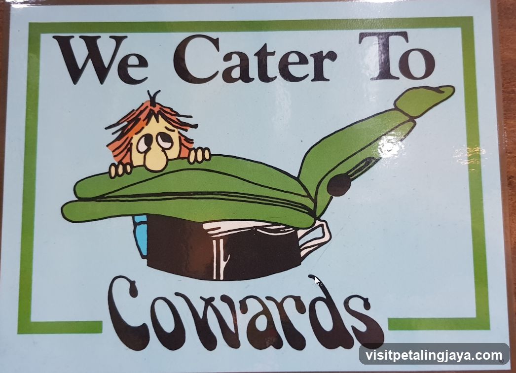 We Cater To Cowards Sign